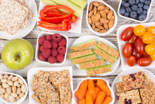 62914016 – healthy snacks on wooden table, top view